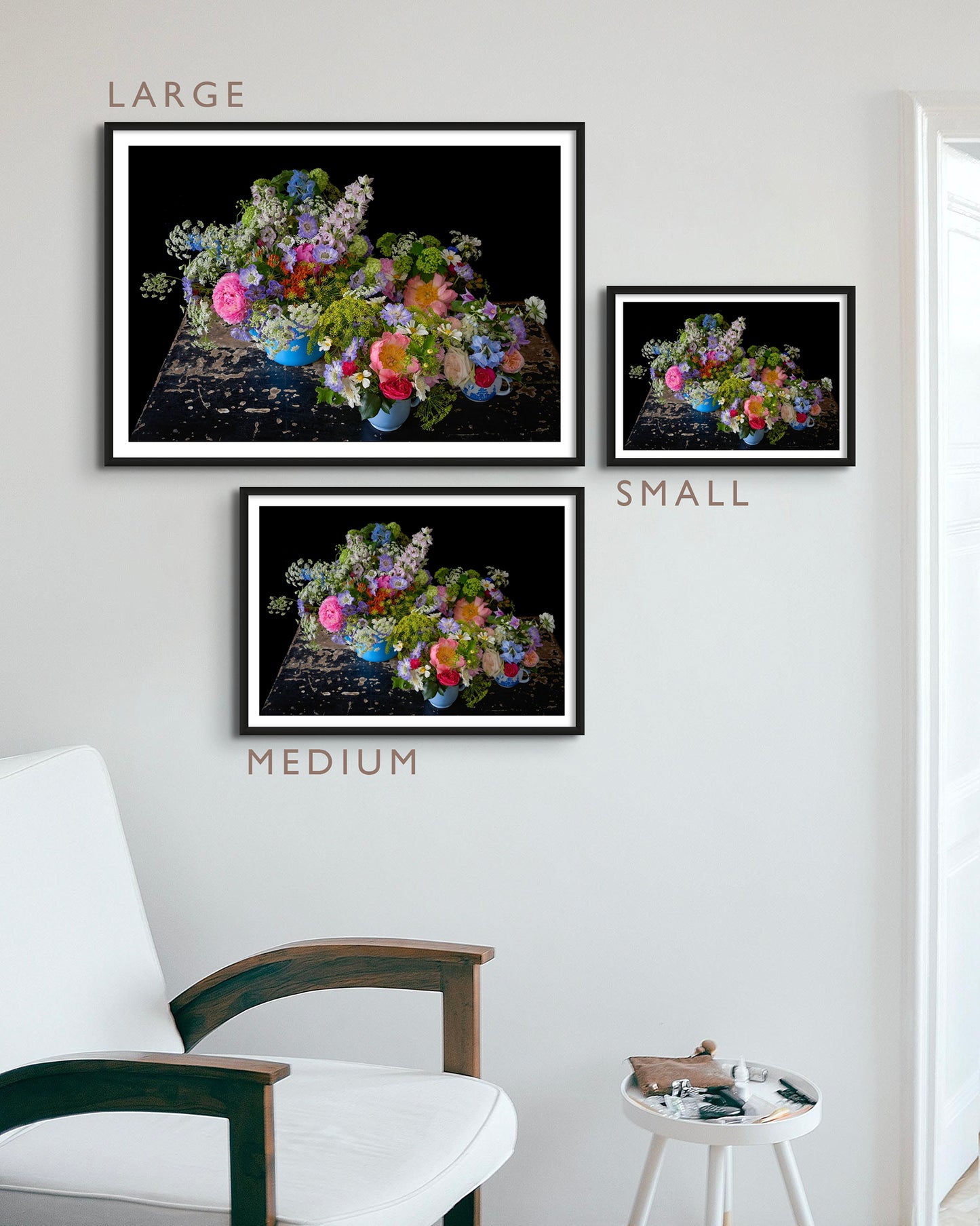 Print Size Guide - Interior picture of Small/Medium/Large 'Dolly' Limited Edition Fine Art Photographic Print Framed & Displayed on a White Wall above an Arm Chair and Side Table.