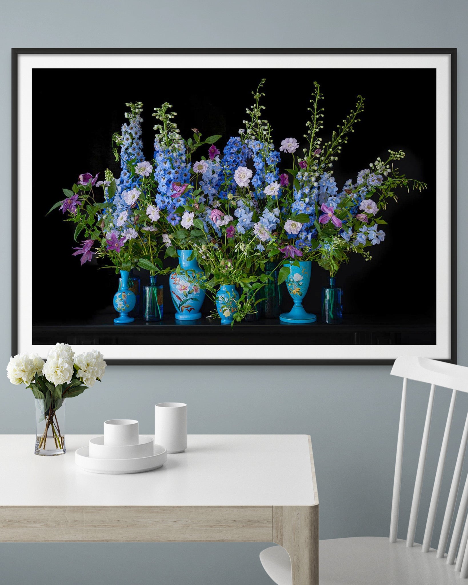 Extra Large Framed Limited Edition Photographic Flower Print 'DELPHINE' hung above a White Table on Farrow & Ball Parma Gray Wall.