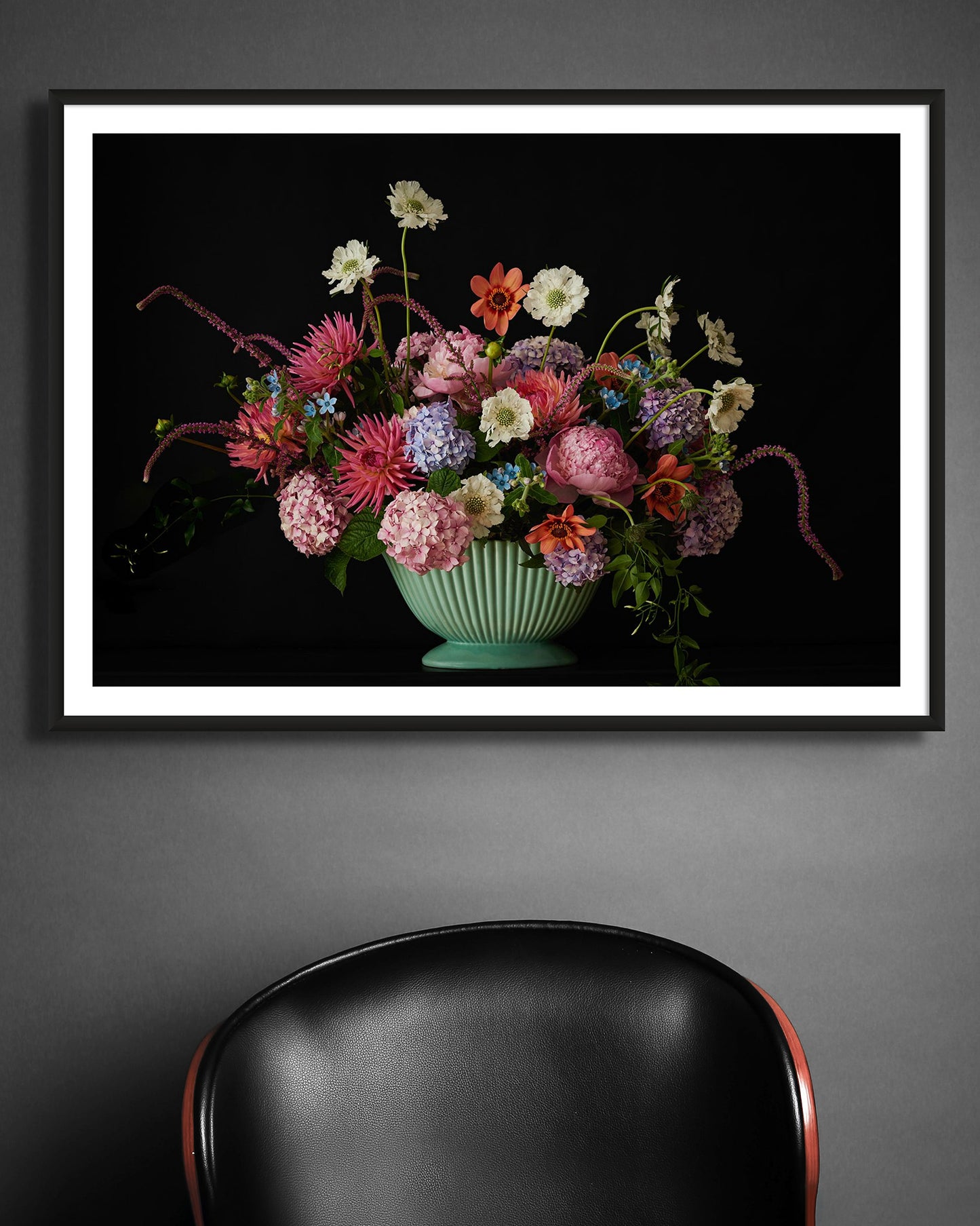 Interior picture of 'Betsy' Limited Edition Fine Art Photographic Print Framed displayed on a grey wall above a leather chair.