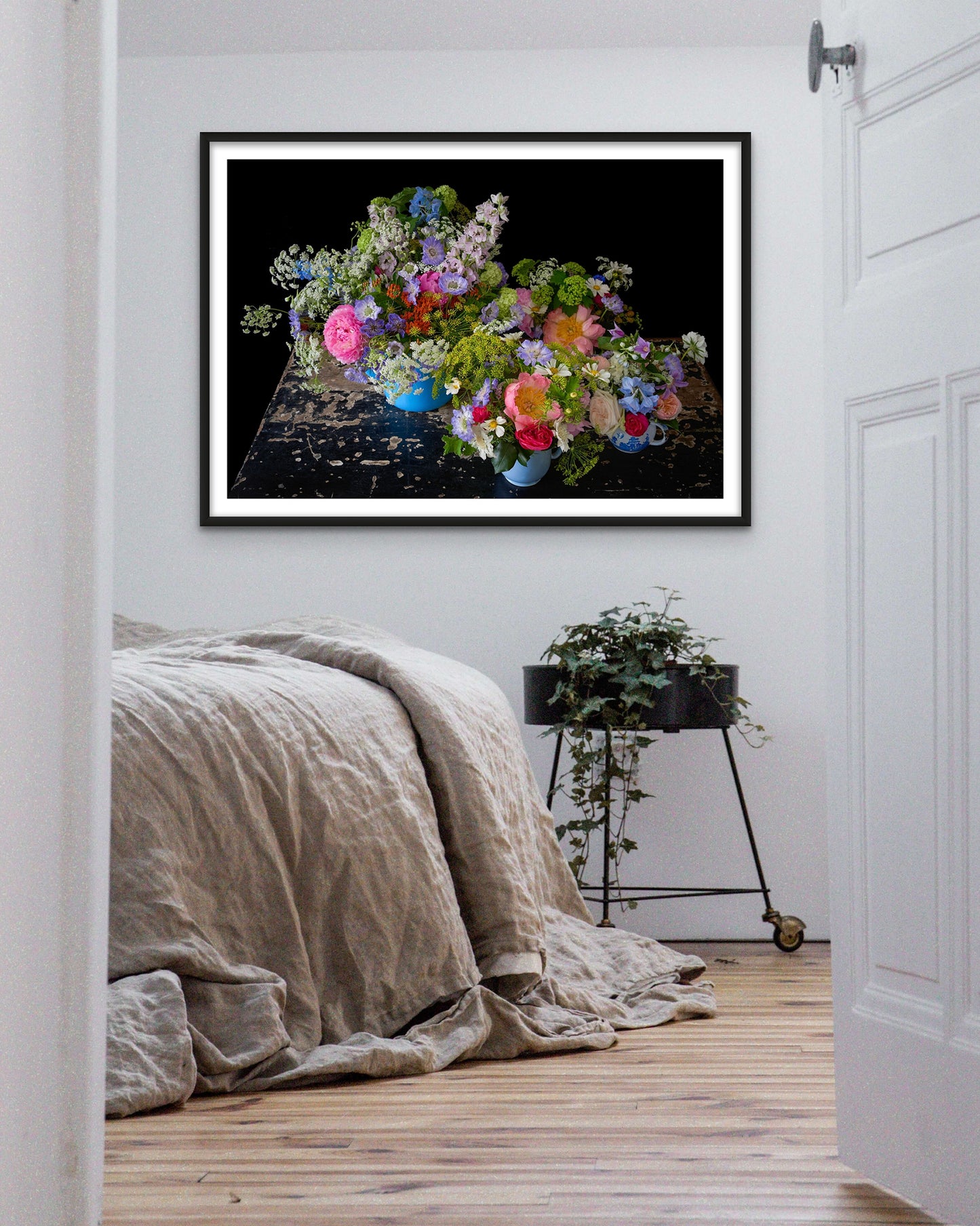 'BETSY' Extra Large Framed Photographic Flower Print Displayed in a Relaxed Bedroom.