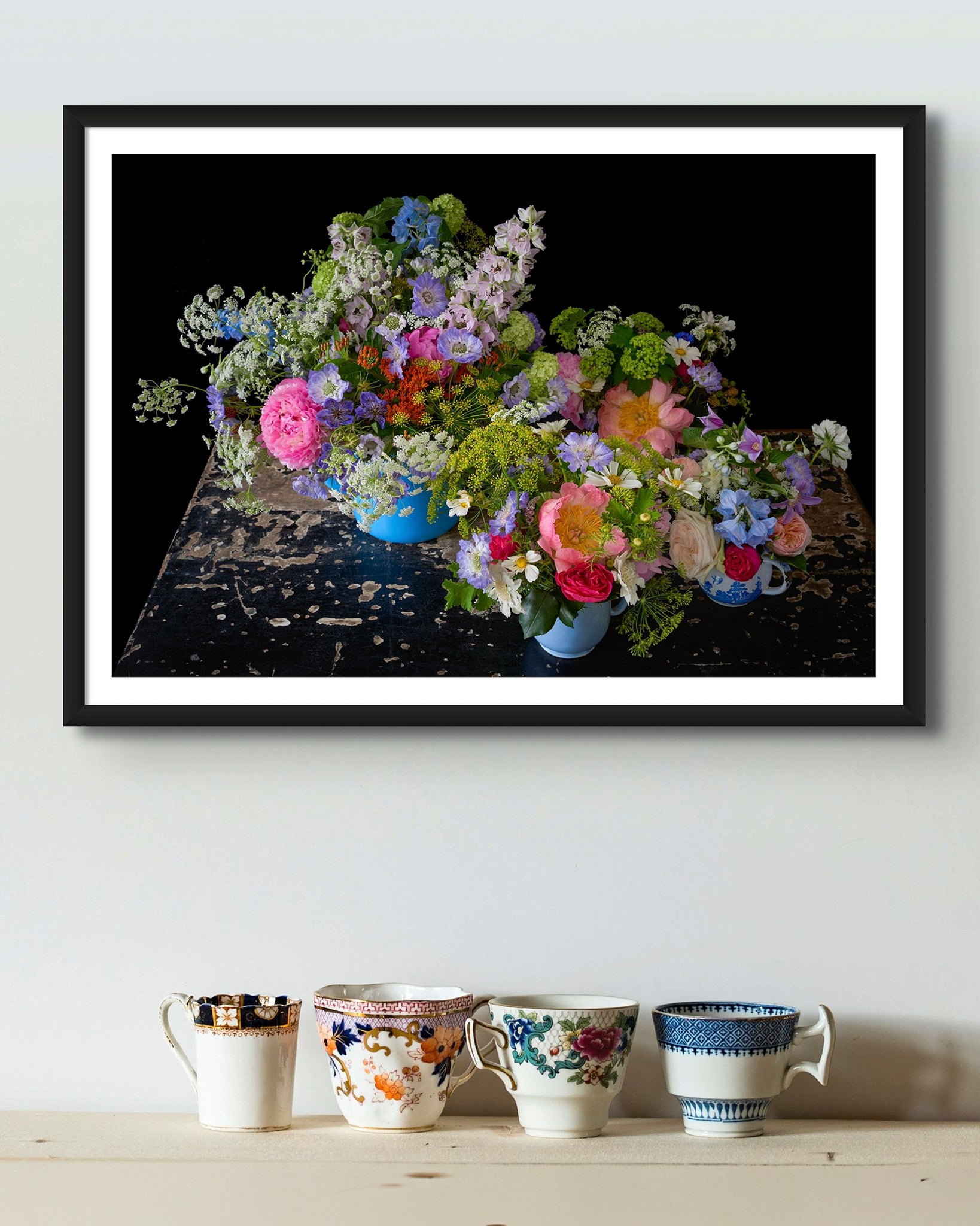 'BETSY' Small Framed Photographic Flower Print Displayed Above A Shelf Displaying Vintage Tea Cups.
